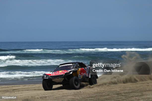 Carlos Sainz of Spain and Peugeot Total drives with co-driver Lucas Cruz of Spain in the 3008 DKR Peugeot car in the Classe : T1.4 2 Roues Motrices,...