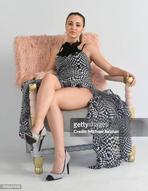 Blaze Modelz Lea Nicole wearing SiiMee Collections poses in a Ulloo forty two chair at New Faces at TAP - The Artists Project on January 10, 2018 in...