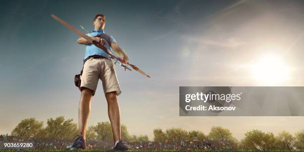 male archer shooting with the longbow at sunset - archery range stock pictures, royalty-free photos & images