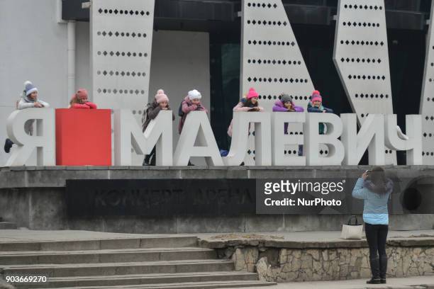 Group of children pose for a photo on front of Malevich concert arena &amp; night club in Lviv. On Wednesday, 11 January 2018, in Lviv, Ukraine.