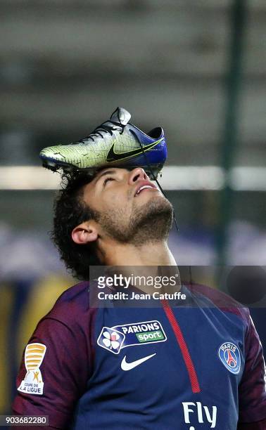 Neymar Jr of PSG celebrates his goal with his Nike shoe on his head during the French League Cup match between Amiens SC and Paris Saint Germain at...