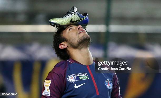 Neymar Jr of PSG celebrates his goal with his Nike shoe on his head during the French League Cup match between Amiens SC and Paris Saint Germain at...