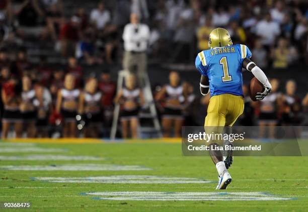 Alterraun Verner of the UCLA Bruins carries the ball to score a touchdown against the San Diego State Aztecs at The Rose Bowl on September 4, 2009 in...