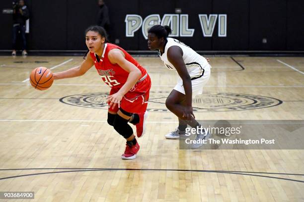 St. John's Cadets Azzi Fudd sets up the play with Paul VI Panthers guard Ashley Owusu in pursuit in the first half January 03, 2018.