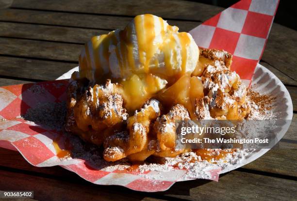 At FunnelDelicious, the Apple Pie A La Mode is a crowd pleaser seen December 29, 2017 in Greenville, SC. Funnel cakes are the tip of the iceberg -...