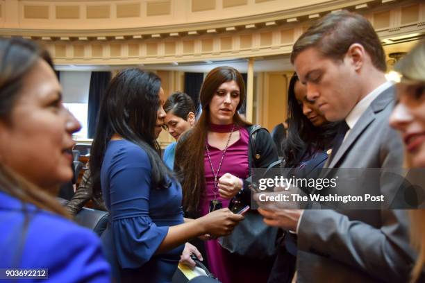 Delegate Danica Roem , C, chats with fellow lawmaker that include Charniele Herring, 2nd from L, Hala Ayalo, 3rd from L, and Jennifer Carroll Foy,...