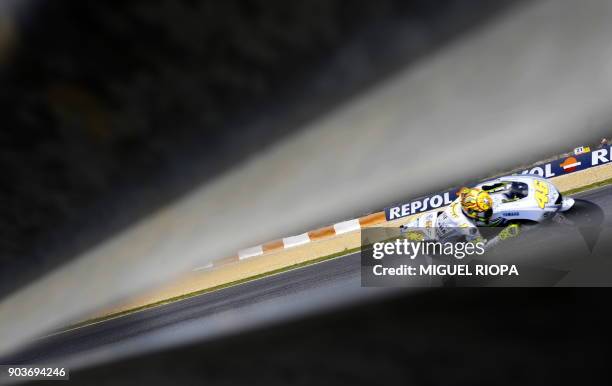 Italian rider Valentino Rossi powers his Yamaha during the Moto GP qualifying practice session of the Grand Prix of Portugal in Estoril, outskirts of...