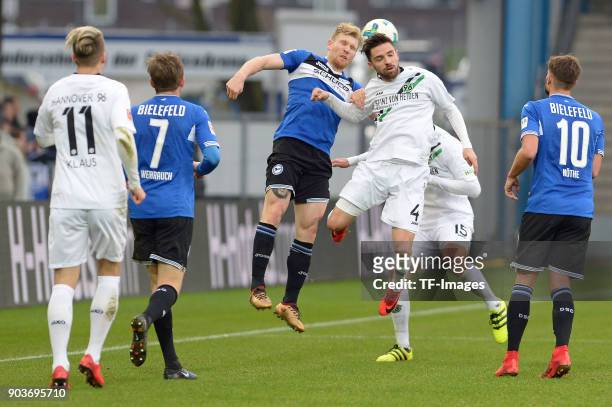 Andreas Voglsammer of Bielefeld and Julian Korb of Hannover battle for the ball during the H-Hotels.com Wintercup match between Arminia Bielefeld and...