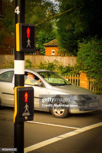 car at a pedestrian crossing - traffic light control box stock pictures, royalty-free photos & images