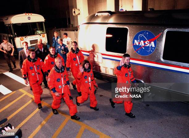 After leaving the Operations and Checkout Building, the STS-88 crew approach the Astrovan for their trip to Launch Pad 39A. In the back row are...