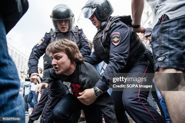 Protester being arrested by the police. Anti-corruption protest organised by opposition leader Alexei Navalny at Tverskaya Street.