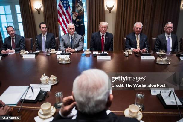 President Donald Trump listens during an expanded bilateral meeting with Indian Prime Minister Narendra Modi in the Cabinet Room of the White House...