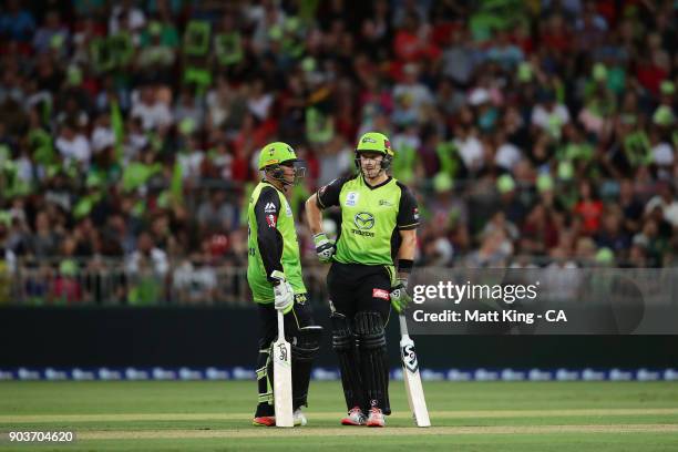 Usman Khawaja and Shane Watson of the Thunder talk between overs during the Big Bash League match between the Sydney Thunder and the Perth Scorchers...