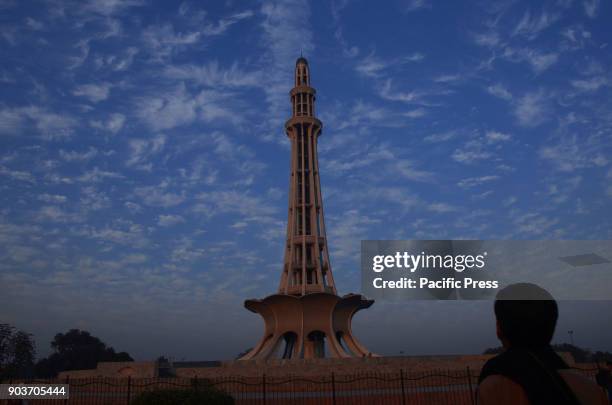 An attractive view of the scattered clouds hovering in the sky over the historical Minar-e-Pakistan during a bright sunny day pleasant weather in the...