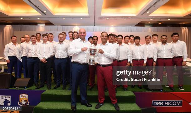 Thomas Bjorn, Captain of Team Europe holds the trophy with Arjun Atwal, Captain of Team Asia whilst they are accompanied by their players during the...