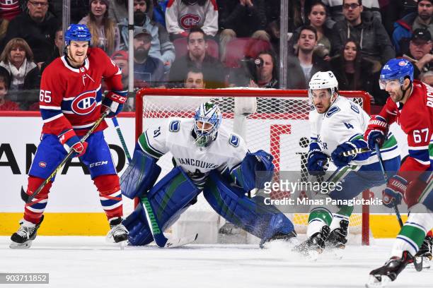 Goaltender Anders Nilsson of the Vancouver Canucks protects his net near Andrew Shaw of the Montreal Canadiens during the NHL game at the Bell Centre...