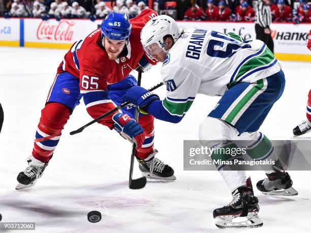 Andrew Shaw of the Montreal Canadiens and Markus Granlund of the Vancouver Canucks take a face-off during the NHL game at the Bell Centre on January...