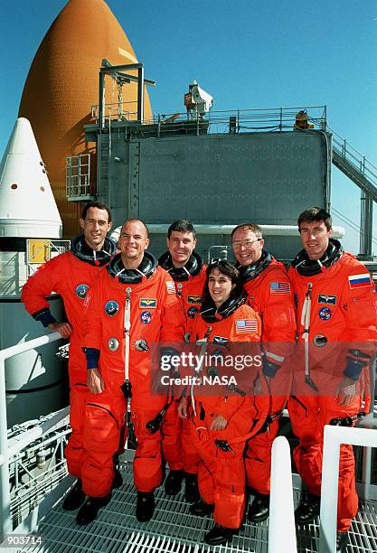 The STS-88 crew leave the Operations and Checkout Building for their trip to Launch Pad 39A. In the front row are Pilot Frederick W. "Rick" Sturckow,...