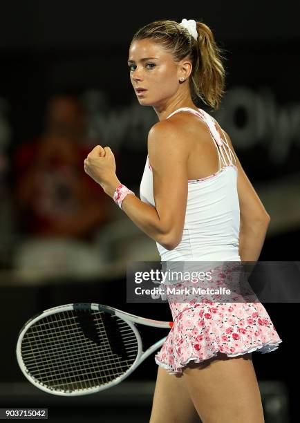 Camila Giorgi of Italy celebrates winning match point in her quarter final match against Agnieszka Radwanska of Poland during day five of the 2018...