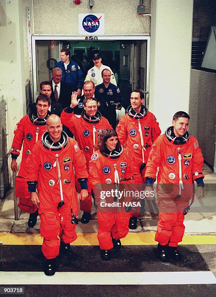 The STS-88 crew leave the Operations and Checkout Building for their trip to Launch Pad 39A. In the front row are Pilot Frederick W. "Rick" Sturckow,...