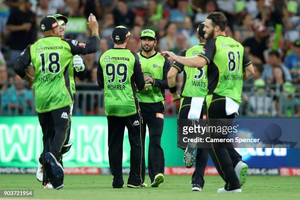Farad Ahmed of the Thunder celebrates catching Will Bosisto of the Scorchers off a delivery by team mate Mitch McClenaghan during the Big Bash League...