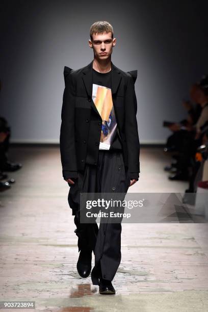 Model walks the runway at the Concept Korea: Beyond Closet e Bmuet show during the 93. Pitti Immagine Uomo at Fortezza Da Basso on January 10, 2018...