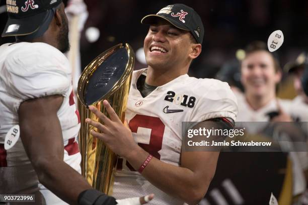 Tua Tagovailoa and Rashaan Evans of the Alabama Crimson Tide celebrates after defeating the Georgia Bulldogs during the College Football Playoff...