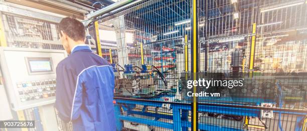 engineer at a control panel - fence panels stock pictures, royalty-free photos & images