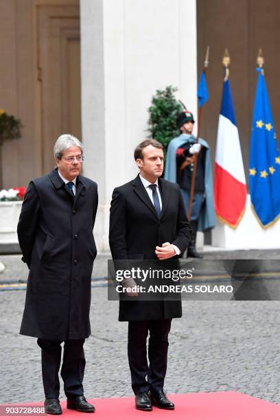 Italian Prime Minister Paolo Gentiloni welcomes France's President Emmanuel Macron before their meeting on January 11, 2018 at the Palazzo Chigi in...