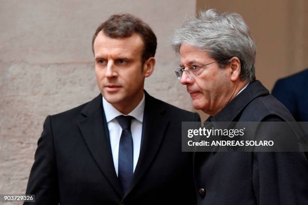 Italian Prime Minister Paolo Gentiloni welcomes France's President Emmanuel Macron before their meeting on January 11, 2018 at the Palazzo Chigi in...