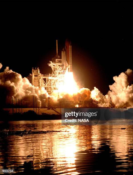 The Space Shuttle Endeavour lights up the night sky as it embarks on the first U.S. Mission dedicated to the assembly of the International Space...