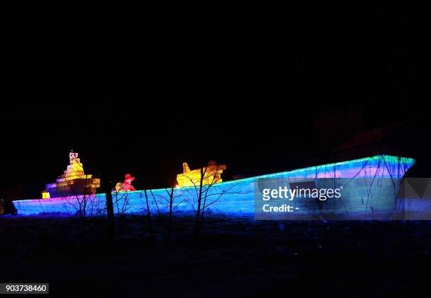 This photo taken on January 10, 2018 shows an ice sculptured aircraft carrier "Liaoning" displayed at the Qipanshan Ice and Snow World during the...