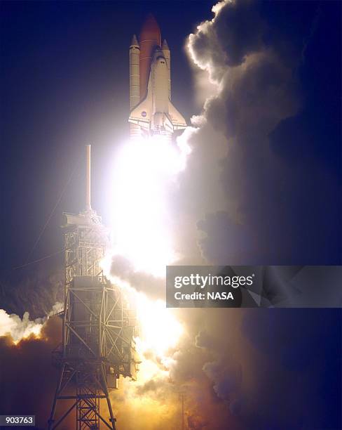 The Space Shuttle Endeavour lights up the night sky as it embarks on the first U.S. Mission dedicated to the assembly of the International Space...