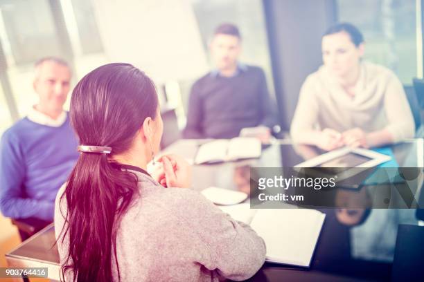 staff meeting - soft focus office stock pictures, royalty-free photos & images