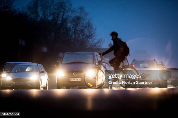 Cyclist passes a street on January 10, 2018 in Berlin, Germany.
