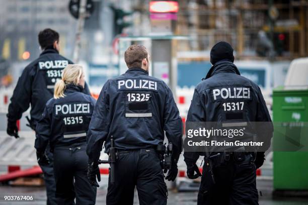 Four police officers are pictured on January 11, 2018 in Berlin, Germany.