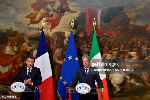 Italian Prime Minister Paolo Gentiloni and France's President Emmanuel Macron give a joint press conference after their meeting on January 11, 2018...