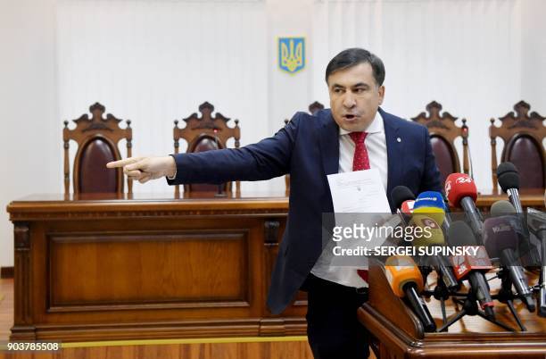 Former Georgian president Mikheil Saakashvili points with his finger when he accuses the prosecutors of corruption prior the appeal hearing at a...