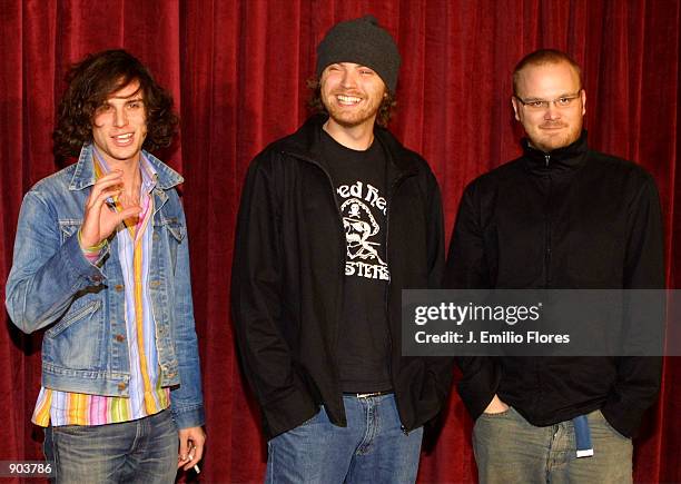 Guy Berryman, Jon Buckland and Will Champion of the British rock group Coldplay arrive at the Capitol/Virgin Records Grammy party in Los Angeles, CA....