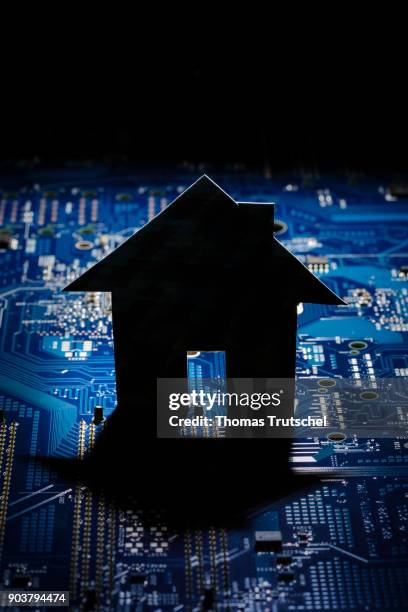 Berlin, Germany Symbolic photo on the topic Smart Home. The model of a house stands on the board of a computer on January 11, 2018 in Berlin, Germany.