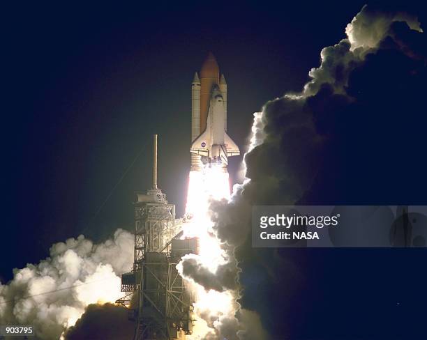 The Space Shuttle Endeavour lights up the night sky as it embarks on the first U.S. Mission dedicated to the assembly of the International Space...