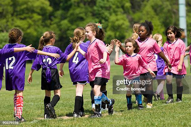 end of a soccer (football) game - shin guard stock pictures, royalty-free photos & images