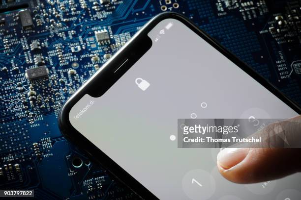 Berlin, Germany Symbolic photo on the topic of Data security on the smartphone. A four-digit security code is entered on a smartphone on January 11,...