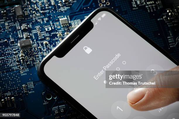 Berlin, Germany Symbolic photo on the topic of Data security on the smartphone. A four-digit security code is entered on a smartphone on January 11,...