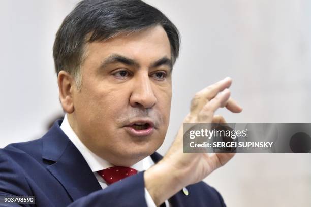 Former Georgian president Mikheil Saakashvili gestures as he speaks to the media prior the appeal hearing at a courthouse in Kiev on January 11,...