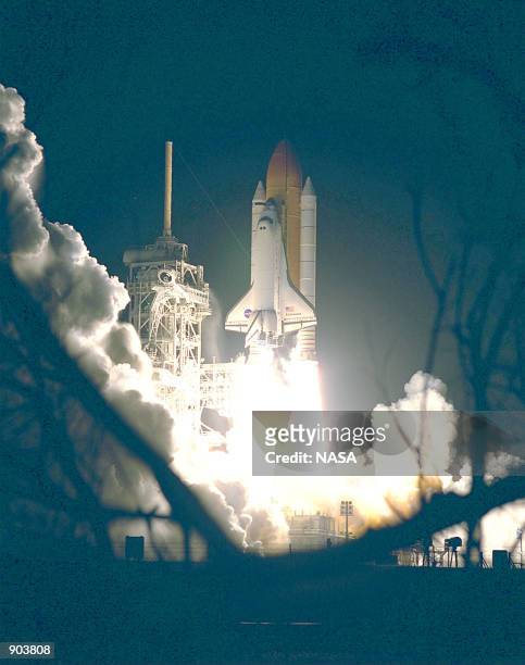 The Space Shuttle Endeavour lights up the night sky as it embarks on the first U.S. Mission dedicated to the assembly of the International Space...