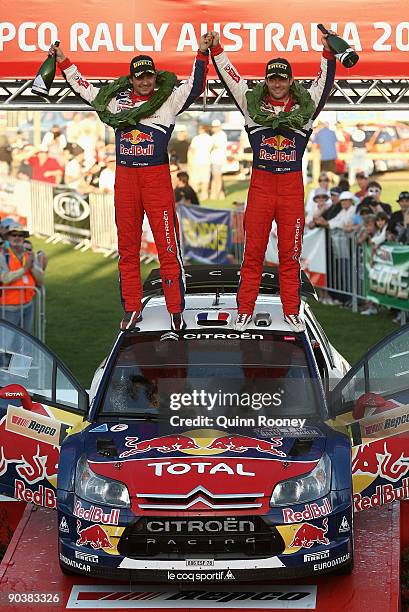 Sebastien Loeb of France and Daniel Elena of Monaco and the Citroen C4 Total team celebrate winning the Repco Rally of Australia on September 6, 2009...