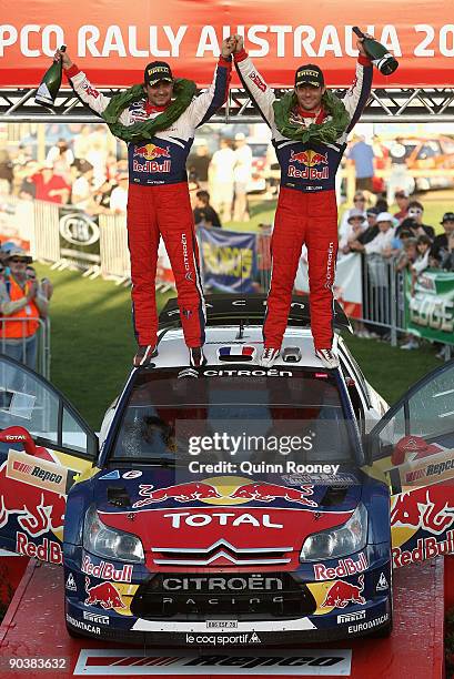 Sebastien Loeb of France and Daniel Elena of Monaco and the Citroen C4 Total team celebrate winning the Repco Rally of Australia on September 6, 2009...