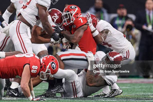 Georgia Bulldogs running back D'Andre Swift is tackled by Alabama Crimson Tide defensive back Minkah Fitzpatrick and Alabama Crimson Tide defensive...