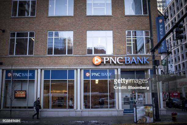 Pedestrian passes in front of a PNC Financial Services Group Inc. Bank branch in downtown Chicago, Illinois, U.S., on Monday, Jan. 8, 2018. PNC...
